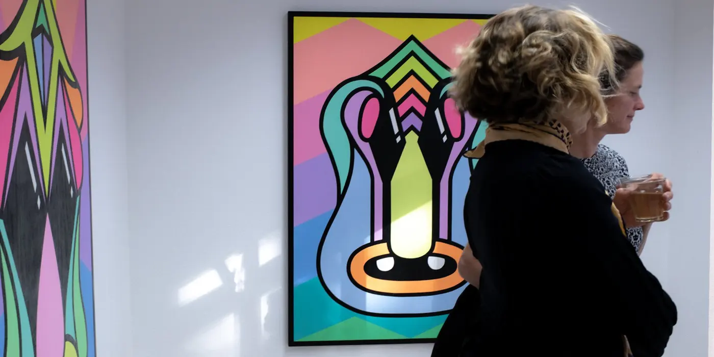 Visitors with paintings by Julia Gaudard at Mauer Gallery